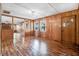 Inviting living room featuring wood paneling, hardwood floors, and ample natural light at 1149 Us-701 Hwy, Four Oaks, NC 27524