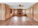 Cozy living room featuring a brick fireplace, built-in shelving, and hardwood floors at 1149 Us-701 Hwy, Four Oaks, NC 27524