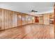 Bright living room featuring hardwood floors, paneled walls, and natural light at 1149 Us-701 Hwy, Four Oaks, NC 27524