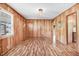Bright living room with wood paneled walls and updated lighting fixtures, providing a warm ambiance at 1149 Us-701 Hwy, Four Oaks, NC 27524