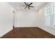 Spacious bedroom featuring a ceiling fan, hardwood floors, and a large window for natural light at 1165 Saint Cloud Loop, Apex, NC 27523