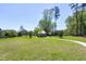 Community gazebo on a large lawn area, surrounded by mature trees and a walking path at 1165 Saint Cloud Loop, Apex, NC 27523