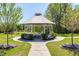 Community gazebo with white supports and a table and seating, surrounded by landscaping at 1165 Saint Cloud Loop, Apex, NC 27523
