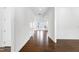 Inviting hallway with gleaming hardwood floors that lead to an open living space at 1165 Saint Cloud Loop, Apex, NC 27523