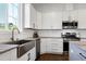 Modern kitchen featuring stainless steel appliances, subway tile backsplash, and granite countertops at 1165 Saint Cloud Loop, Apex, NC 27523
