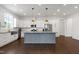 Spacious kitchen with a large island, stainless steel appliances, and ample counter space at 1165 Saint Cloud Loop, Apex, NC 27523