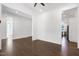 Open living space with hardwood floors and views into the entryway and kitchen at 1165 Saint Cloud Loop, Apex, NC 27523