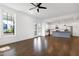 Bright, open-concept living area leading to the modern kitchen with island and stainless steel appliances at 1165 Saint Cloud Loop, Apex, NC 27523