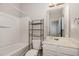 Full bathroom featuring a shower-tub combo and modern fixtures at 117 Gallent Hedge Trl, Apex, NC 27539