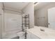 Bathroom with white fixtures, a bathtub-shower combination, and neutral decor at 117 Gallent Hedge Trl, Apex, NC 27539