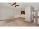 Open-concept living room with a view of the kitchen and a classic ceiling fan at 117 Gallent Hedge Trl, Apex, NC 27539