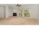 Bright living room with sliding doors to the backyard and a cozy fireplace at 117 Gallent Hedge Trl, Apex, NC 27539