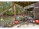 Cozy covered patio space with greenery creating a tranquil outdoor retreat at 117 Gallent Hedge Trl, Apex, NC 27539
