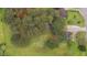 Aerial view of a home with lush green surroundings showcasing a spacious lot and a private setting at 120 Stillmeadow Dr, Louisburg, NC 27549