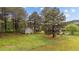 Fenced backyard with storage shed and mature trees offering shade and privacy at 120 Stillmeadow Dr, Louisburg, NC 27549