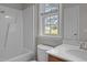Bright bathroom featuring a shower-tub combo at 120 Stillmeadow Dr, Louisburg, NC 27549