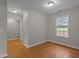 Empty bedroom with wood floors and natural light at 120 Stillmeadow Dr, Louisburg, NC 27549