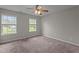 Spacious bedroom with neutral walls, carpet, and bright windows at 120 Stillmeadow Dr, Louisburg, NC 27549