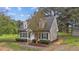 Well-kept home with neutral siding, dormer windows, manicured landscaping, and a paved walkway at 120 Stillmeadow Dr, Louisburg, NC 27549