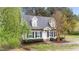 Inviting home showcasing classic architecture, neat landscaping, and a welcoming front entrance at 120 Stillmeadow Dr, Louisburg, NC 27549