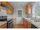 Traditional style kitchen with wood cabinets and stainless steel oven at 120 Stillmeadow Dr, Louisburg, NC 27549