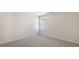 This carpeted bedroom features neutral walls and a window providing natural light at 121 Pisgah St, Sanford, NC 27330