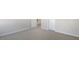 An empty bedroom featuring carpet and a doorway to another room at 121 Pisgah St, Sanford, NC 27330