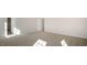 A well-lit bedroom with plush carpet, neutral walls, and a bright, airy feel at 121 Pisgah St, Sanford, NC 27330