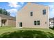 The backyard of a two-story home with a well-maintained lawn and patio area at 121 Pisgah St, Sanford, NC 27330