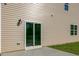 A view of the home's back patio and sliding glass door leading inside at 121 Pisgah St, Sanford, NC 27330