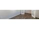 Bright room featuring modern flooring, fresh paint, and a door with glass panels at 121 Pisgah St, Sanford, NC 27330