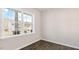 Bright room boasting new flooring, fresh paint, and a large window overlooking the neighborhood at 121 Pisgah St, Sanford, NC 27330