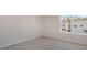Cozy bedroom featuring a window overlooking the neighborhood, offering a peaceful and private space at 124 Pisgah St, Sanford, NC 27330
