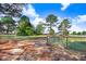 Large grassy backyard bordered by a chain link fence and mature trees at 13 Parkers Pointe Dr, Benson, NC 27504