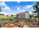 View of a home from the backyard showcasing solar panels and fenced in yard at 13 Parkers Pointe Dr, Benson, NC 27504
