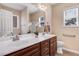 Bathroom with double vanity, framed mirror, and large window for natural light at 13 Parkers Pointe Dr, Benson, NC 27504