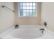 Close up of bathtub showing large soaking tub with chrome faucet and decorative window at 13 Parkers Pointe Dr, Benson, NC 27504