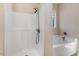 Clean bathroom featuring a walk-in shower and a soaking tub with a window above at 13 Parkers Pointe Dr, Benson, NC 27504