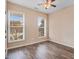 Bedroom featuring natural light with hardwood floors and modern ceiling fan at 13 Parkers Pointe Dr, Benson, NC 27504