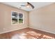 Bedroom showcasing wood laminate flooring, neutral walls and plenty of natural light at 13 Parkers Pointe Dr, Benson, NC 27504