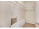 Walk-in closet with open shelving, neutral carpet and ample storage space at 13 Parkers Pointe Dr, Benson, NC 27504