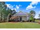 Charming single-story home features a well-manicured front lawn and inviting covered porch at 13 Parkers Pointe Dr, Benson, NC 27504