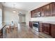 Bright kitchen boasts stainless steel appliances, dark wood cabinets, and an adjacent dining area at 13 Parkers Pointe Dr, Benson, NC 27504