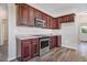 Kitchen showcases stainless steel oven and microwave, granite counters, and hardwood floors at 13 Parkers Pointe Dr, Benson, NC 27504
