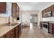 Kitchen features stainless steel sink and appliances, granite counters, and a table with seating at 13 Parkers Pointe Dr, Benson, NC 27504
