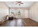 Bright living room featuring hard surface floors, natural light and a ceiling fan at 13 Parkers Pointe Dr, Benson, NC 27504