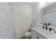 Modern bathroom featuring a stylish shower curtain, white vanity, and a sleek mirror at 1307 Crabapple Ln, Raleigh, NC 27607