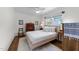 Well-lit bedroom with neutral color palette and ceiling fan at 1307 Crabapple Ln, Raleigh, NC 27607