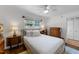 Cozy bedroom featuring a wooden bed frame, ample natural light, and hardwood floors at 1307 Crabapple Ln, Raleigh, NC 27607