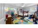Bright bedroom with a desk, colorful rug, and ample natural light at 1307 Crabapple Ln, Raleigh, NC 27607